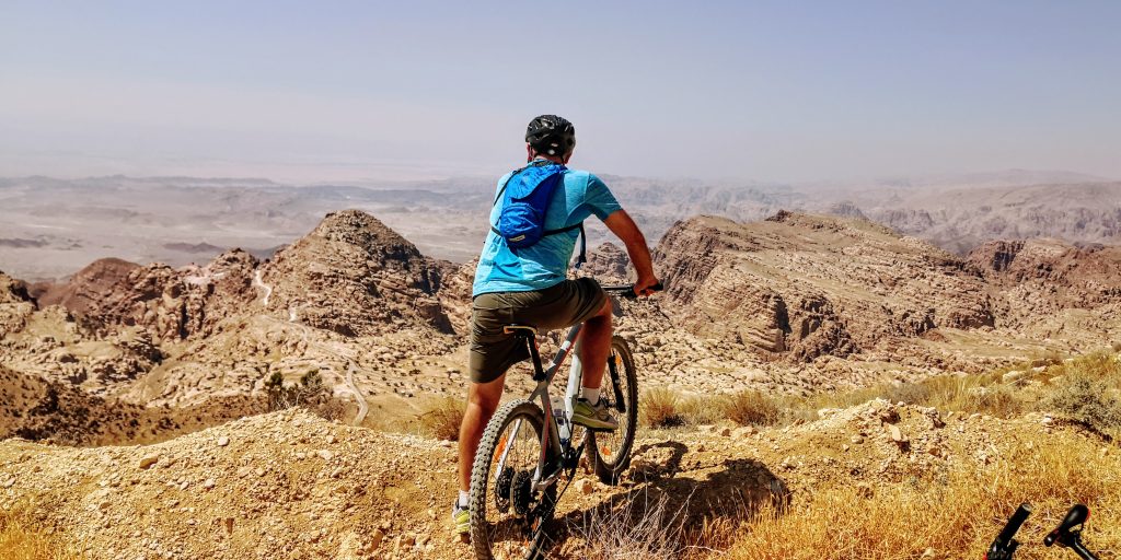 Cyclist overlooking Wadi Araba